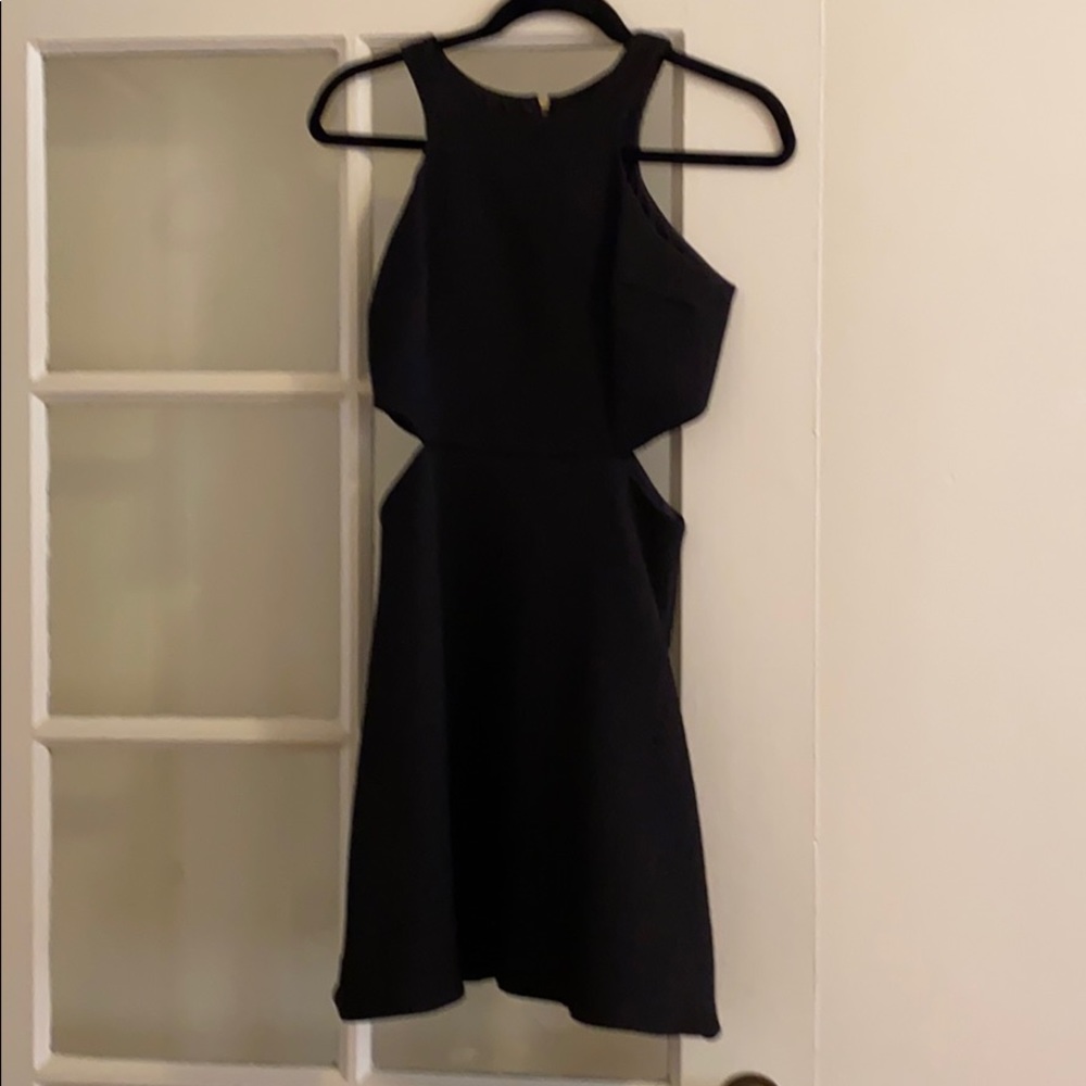 Sleeveless black dress with side cut outs